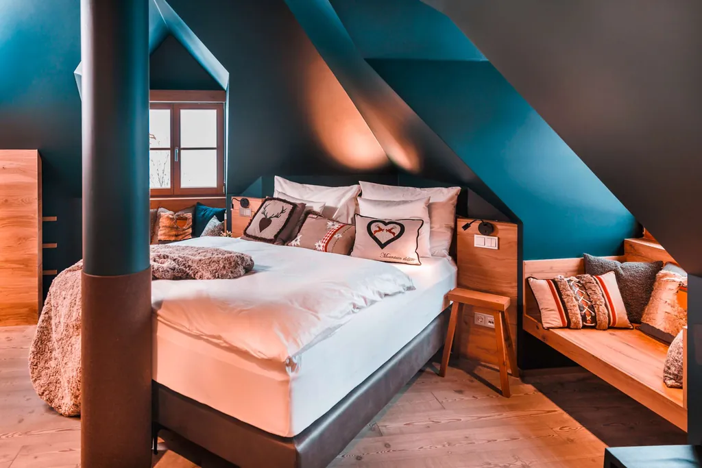 Ein Bett in einem Zimmer des Sport- und Wellnesshotel A-ROSA Kitzbühel