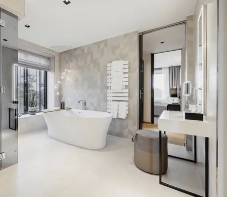 helles Badezimmer im Öschberghof mit freistehender Badewanne, verglaster Regendusche und Schminktisch mit Hocker