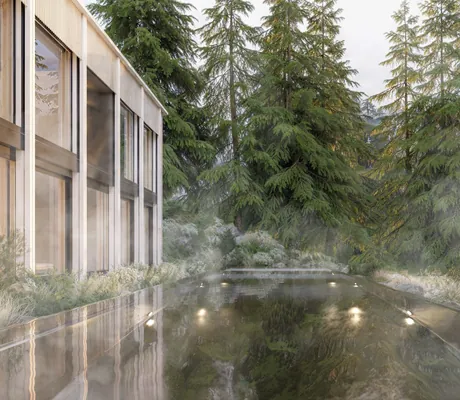 Outdoorpool im Suvretta House mit dampfendem Wasser und Blick auf die Tannen