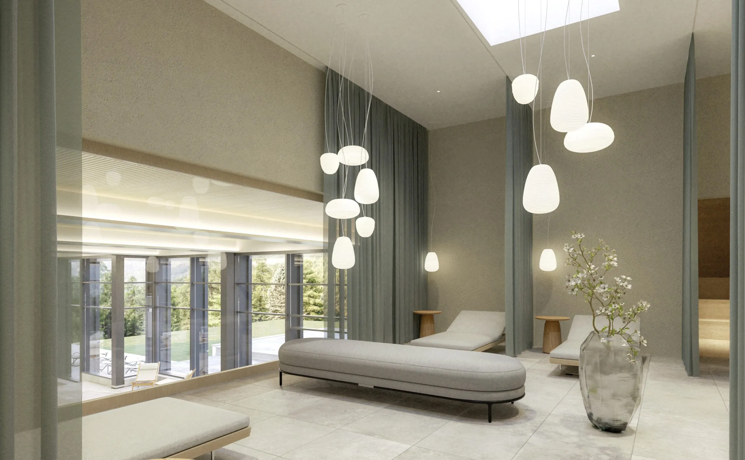 Ruehraum im Suvretta House mit grauen Liegen und gro&szlig;er Vase mit wei&szlig;en Bl&uuml;ten