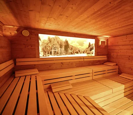 Sauna im Naturhotel Waldesruhe mit beleuchtetem Bild von Landschaft