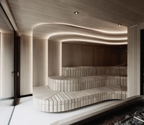 Sauna mit abgerundeten Sitzbänken und Lichtelementen im Hotel Solvie